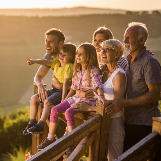 Family at sunset overlooking field