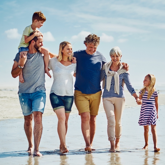 Family walking on beach